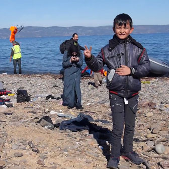 Refugee child arriving on Island of Lesvos
